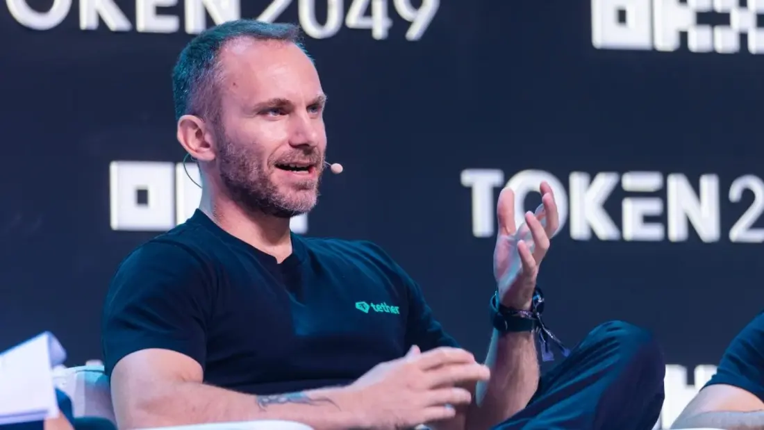 Confident tech executive at desk with USDT stablecoin logo on screen, editorial fintech illustration